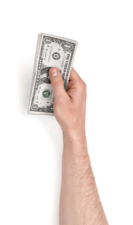 Close up view of a man's hand holding one dollar bills isolated on white background.の写真素材