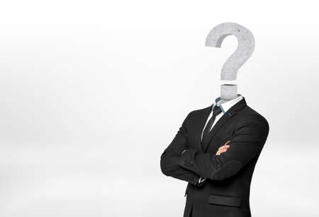 Businessman with question mark instead of head. Deadlock issue. Ideas and concepts. Confusion and uncertainty.の写真素材