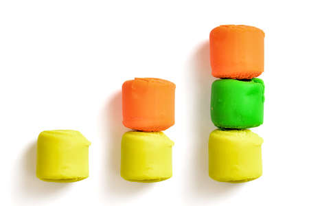 Bar chart made of colourful pieces of modelling clay isolated on white background. Bright colours. Cheerful mood. Rising up.の写真素材