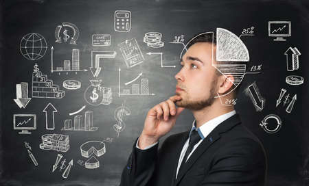 Meditative businessman is looking for the best solution for business development processの写真素材