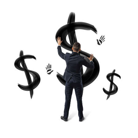 Businessmen on white background placing hands on black painted dollar signs and hand prints.の写真素材