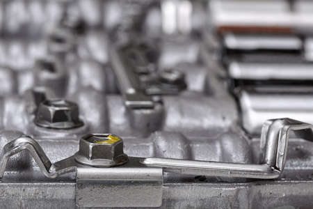 Mechanical parts focused on metal screws holding metal plates.の写真素材