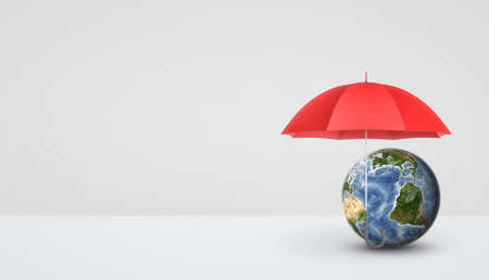 An open red umbrella standing vertically on the handle and keeping safe a small Earth globe.の写真素材