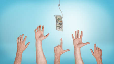Many pointing, grabbing, greeting male hands aiming for a dollar bill caught on a hook. Everyone likes money. Best offer sale. Financial motivation.の写真素材