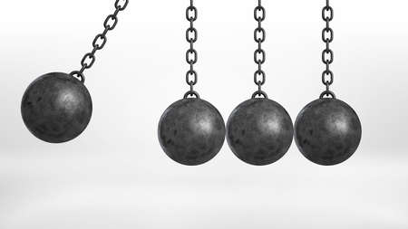 3d rendering of a wrecking ball swinging on white background beside three still hanging balls on white background.の写真素材