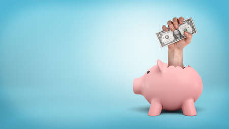 A small piggy bank on blue background with a giant male hand sticking out from its back and holds dollar bills.の写真素材