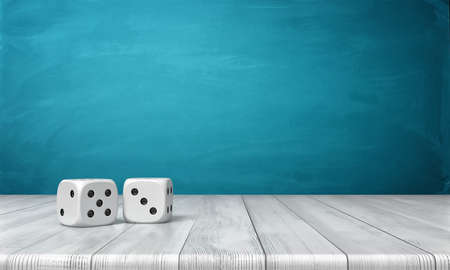 3d rendering of two white dice on a wooden desk on a blue background.の写真素材