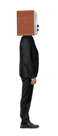 A single isolated businessman standing straight in a side view with a TV box on his head. Bの写真素材