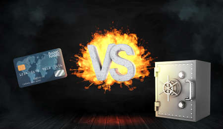 3d rendering of large concrete letters VS on fire stand between a generic blue credit card and a metal bank safe box.の写真素材