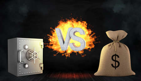 3d rendering of a large letters VS stand flaming between a metal bank safe and a large money bag.の写真素材