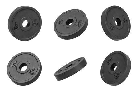3d rendering of many isolated black 5 kg barbell weights hanging on a white background turned to different sides.の写真素材