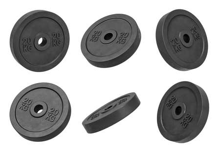 3d rendering of many isolated black 20 kg barbell weights hanging on a white background turned to different sides.の写真素材