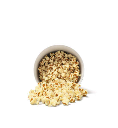 3d rendering of a round striped popcorn bucket lying on its side with popcorn spilling out of it.の写真素材