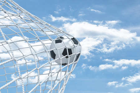 3d rendering of a football ball caught in a white net from the gates on a sky background.の写真素材