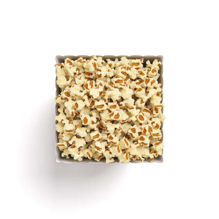 3d rendering of an isolated square popcorn bucket filled with the snack to the brim in a top view on a white background.の写真素材