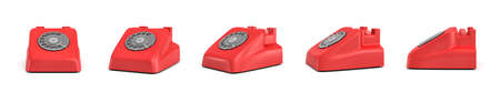 3d rendering of five isolated red retro rotary phones without receivers standing in different angles.の写真素材