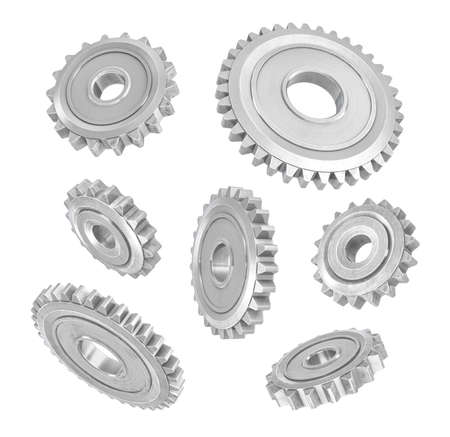 3d rendering of several metal spur gears hanging in different angles on a white background.の写真素材