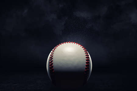 3d rendering of a single baseball ball in a close view under a spotlight on a dark background.の写真素材