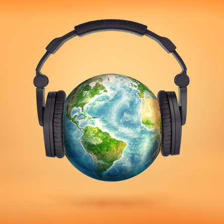 3d rendering of large black headphones placed on an Earth globe pretending its a head.の写真素材