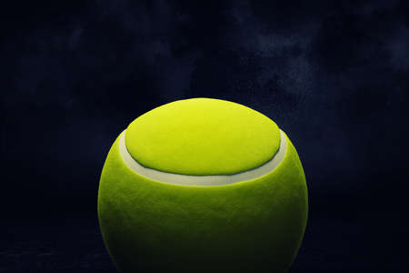 3d rendering of a yellow tennis ball shown in close view on a dark background.の写真素材