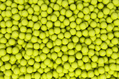 3d rendering of many acid yellow tennis balls lying in a heap as seen from above.の写真素材