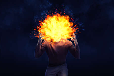 A dark shape of an angry man with an exploding head on a black background.