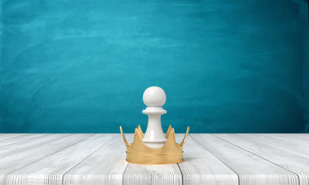 3d rendering of a small white chess pawn standing inside a golden crown on a wooden desk background.の写真素材