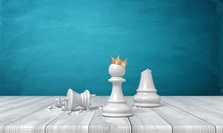 3d rendering of a small white pawn wearing a golden crown and standing near a broken white king on a white background.の写真素材