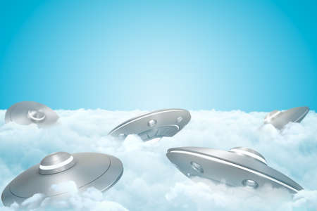 3d rendering of set of UFOs on thick layer of white fluffy clouds with blue sky above.の写真素材
