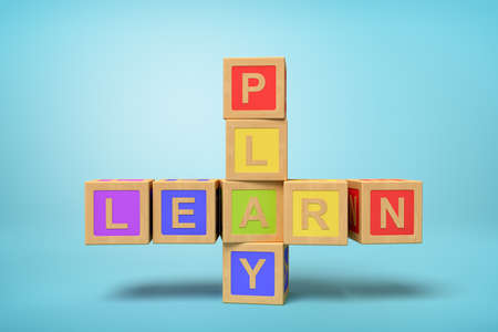 3d rendering of colorful alphabet toy blocks making LEARN and PLAY signs on blue backgroundの写真素材