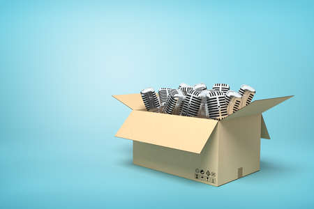 3d rendering of cardboard box full of microphones on blue background.の写真素材