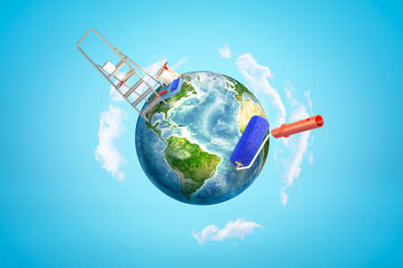 3d rendering of colored earth globe with paint roller, bucket and stepledder on blue sky backgroundの写真素材