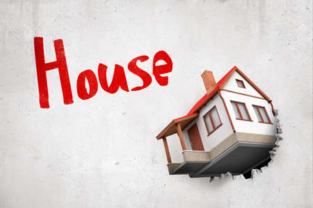 3d rendering of white house with red roof breaking white wall with House sign on white background. Digital art. Building and construction. Private property.の写真素材