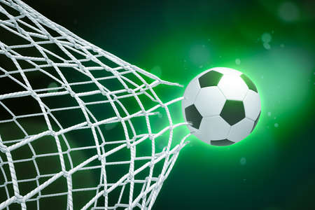 3d rendering of soccer ball tearing through net on green gradient bokeh background.の写真素材