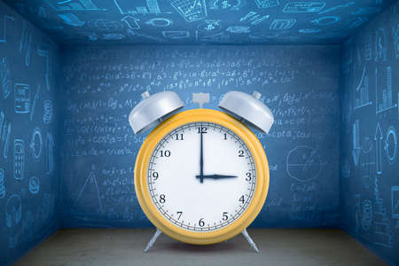 3d rendering or yellow alarm clock on blue math formula backgroundの写真素材