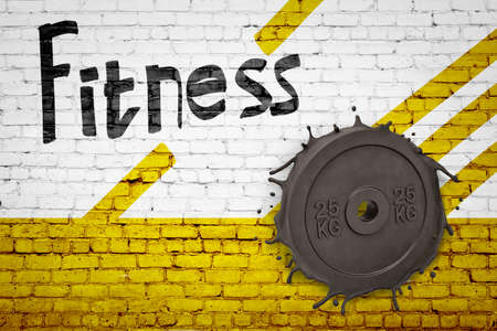 3d rendering of white brick wall, half-painted yellow, with title Fitness, and 25KG weight plate smashed into it.の写真素材