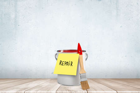 3d rendering of paint brush and bucket with Repair note on white wall backgroundの写真素材