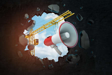 3d rendering of hoisting crane carrying megaphone and breaking hole in black wall with blue sky seen through.の写真素材