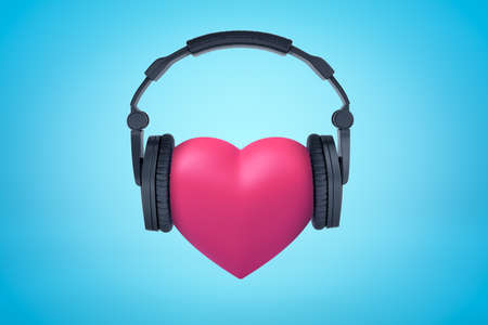 3d rendering of pink heart with black headphones on blue backgroundの写真素材