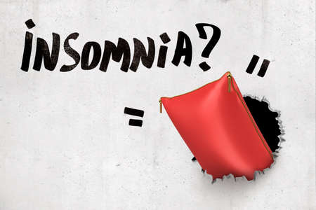 3d rendering of concrete wall with title Insomnia and red satin pillow that has broken through from behind the wall.の写真素材