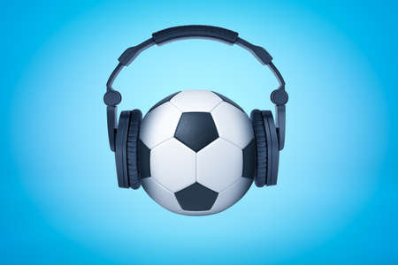 3d rendering of a football with black headphones on like on human head on light blue background. Leisure and entertainment. Popular hobbies. Sport anthems.の写真素材