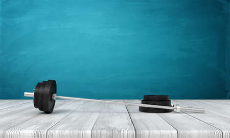 3d rendering of barbell with one weight plate taken off, lying on wooden surface near blue wall with copy space.の写真素材