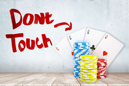 3d rendering of casino tokens and playing cards on white wooden floor with Dont touch sign on white wall backgroundの写真素材