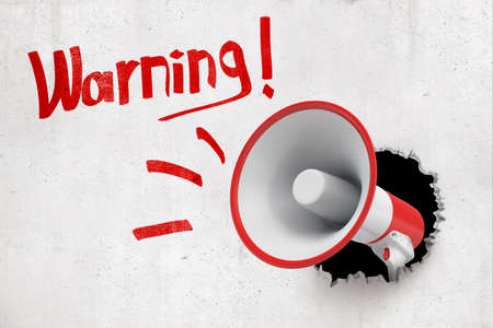 3d rendering of a red and white megaphone breaking white wall with red Warning sign on white backgroundの写真素材