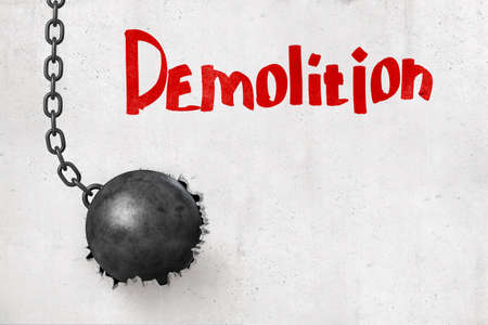 3d rendering of wrecking ball that has broken hole in concrete wall with title Demolition.の写真素材