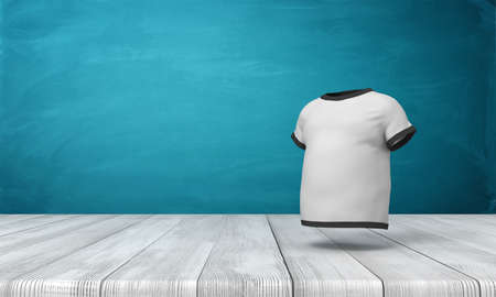 3d rendering of white mens T-shirt with black edge piping, suspended in air above wooden floor, near blue wall.の写真素材