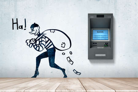 3d rendering of ATM machine and cartoon male robber holding money bag with dollars falling out on white wall backgroundの写真素材