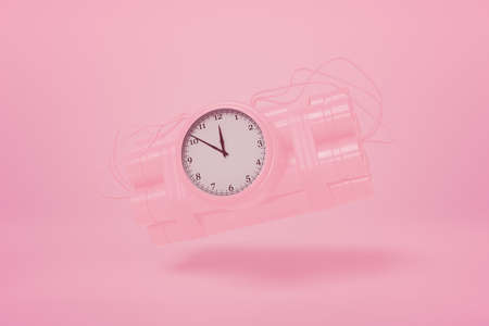 3d rendering of pastel pink dynamite bundle with time bomb floating on pink background of the same color.の写真素材