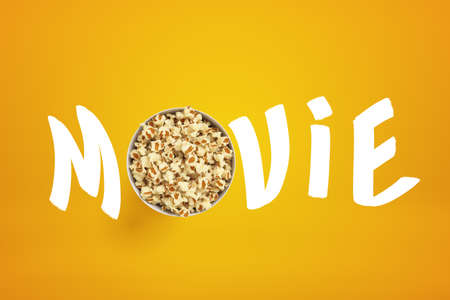 3d rendering of MOVIE sign with popcorn bucket instead of O letter on yellow backgroundの写真素材