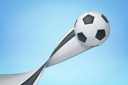 3d rendering of a football flying up and leaving a pixel stretch trail behind it on light blue background.の写真素材
